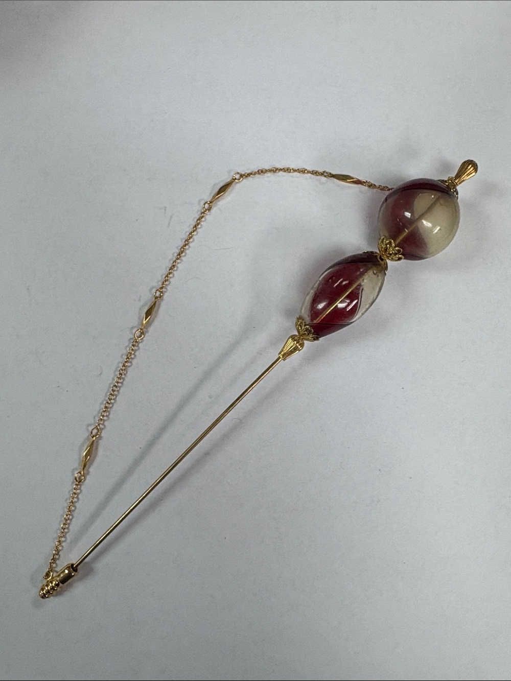 Gold-Tone Stick Brooch with Red and Cream Glass Beads